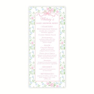 May include: A floral-themed baby shower menu with a pink ribbon and the text "Whitney's Baby Shower Menu". The menu lists starters, main courses, dessert, and beverages.