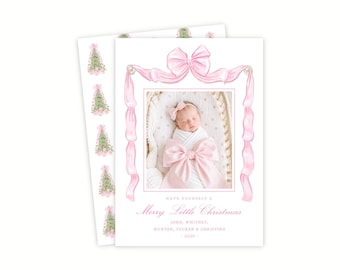 May include: A rectangular holiday card featuring a central photograph of a swaddled infant with a pink bow, framed by a large pink ribbon illustration. The text reads: HAVE YOURSELF A Merry Little Christmas JOHN, WHITNEY, HUNTER, TUCKER & CHRISTINA - 2030 -.