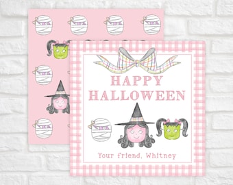 May include: A square card with a pink gingham border featuring a watercolor illustration of a bow, a witch, and a green monster. The text reads HAPPY HALLOWEEN and Your friend, Whitney. A second card behind it shows a repeating pattern of mummies.