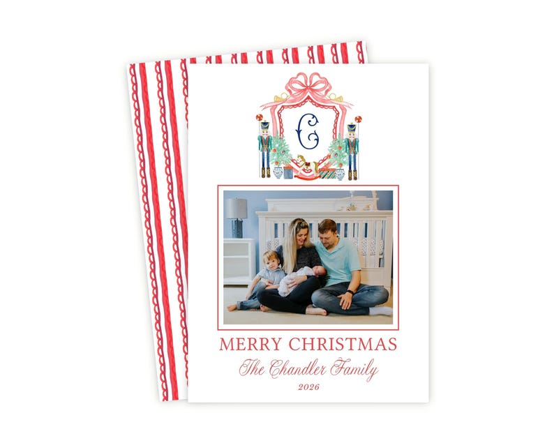 May include: A rectangular Christmas card featuring a watercolor crest with a letter C, nutcrackers, and a rocking horse. Below is a photograph of a family of four, with the text MERRY CHRISTMAS, The Chandler Family, and the year 2026 printed below.