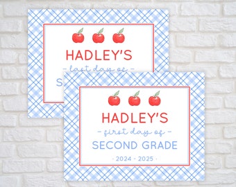 May include: Two signs with a blue and white checkered background. The top sign says "HADLEY'S - last day of -" with three red apples. The bottom sign says "HADLEY'S - first day of - SECOND GRADE 2024-2025." with three red apples.