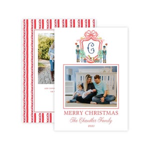 May include: A white Christmas card featuring a watercolor crest with a pink bow, nutcrackers, and a letter C. Below the crest is a photo of a family, the text MERRY CHRISTMAS, The Chandler Family, and 2023. The card has a red striped border.