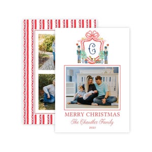 May include: A white Christmas card featuring a red striped border, a crest with a letter C, nutcracker illustrations, and three photographs of a family. The text reads MERRY CHRISTMAS, The Chandler Family, and 2023 in red and black lettering.