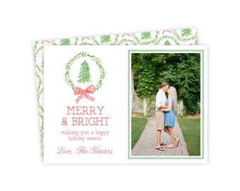 May include: A rectangular holiday greeting card featuring a watercolor illustration of a green wreath with a red plaid bow and a pine tree. The text reads MERRY & BRIGHT, wishing you a happy holiday season, Love, The Keeners, with a photo insert.