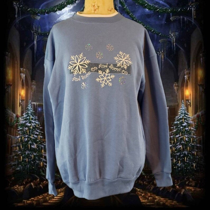 Extremely soft light blue vintage 1990s Christmas winter crewneck sweatshirt.