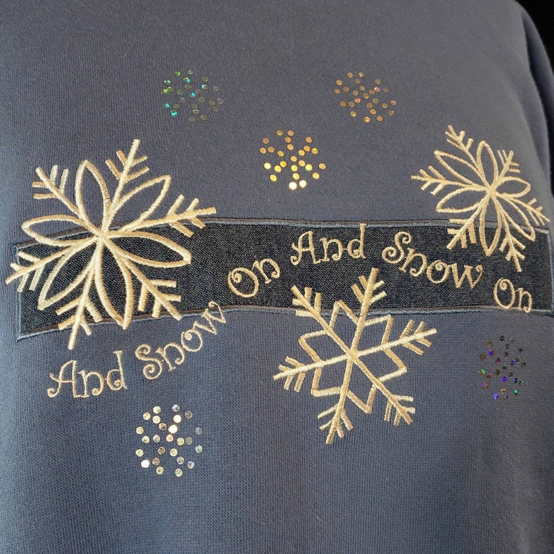 Extremely soft light blue vintage 1990s Christmas winter crewneck sweatshirt.