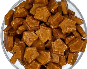 May include: A bowl filled with brown house-shaped candy sprinkles.