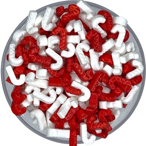 Zuckerstangen-rote und weiße Zuckerstangen-Streusel -- Weihnachtsfeiertag-Winter-Feiertag-Weihnachtsdekoration