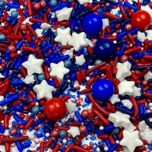 May include: Red, white, and blue sprinkles with stars, balls, and rods.  These sprinkles are perfect for decorating cakes, cupcakes, and other treats.