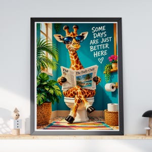 May include: A framed wall art print featuring a giraffe wearing black sunglasses, sitting on a white toilet, and reading a newspaper titled The Daily Chill. The text reads Some Days Are Just Better Here with a heart symbol. The scene includes a potted plant.