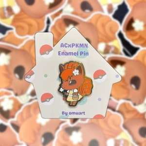 May include: A brown and orange enamel pin of a Vaporeon Pokemon character holding a flower. The pin is on a white card with the text "ACxPKMN Enamel Pin" and "By omuart".