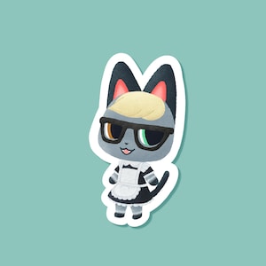 May include: A sticker featuring a cartoon cat character with gray fur, wearing black glasses, a maid outfit, and a blonde hairstyle. The cat has one brown eye and one green eye, with a small pink tongue sticking out.