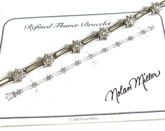 Nolan Miller 2004 Refined Flower Silver-tone Chain Link 7 1/2” Bracelet with Stations of Floral Clustered Crystals