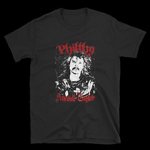 May include: Black t-shirt with a red graphic of a man with long hair and the text "Philthy Animal Taylor".