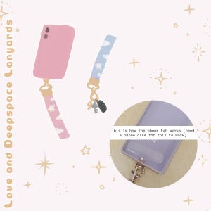 May include: A pink phone case with a pink and white cloud-patterned wrist lanyard, a blue and white cloud-patterned wrist lanyard with keys, and a circular inset showing a clear phone case with a tab and metal clip. Text reads Love and Deepspace Lanyards.