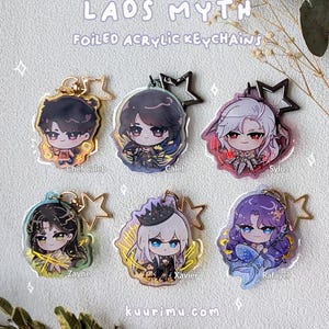 May include: Six foiled acrylic keychains labeled LADS MYTH featuring chibi-style character illustrations of Chef Caleb, Caleb, Sylus, Zayne, Xavier, and Rafayel. Each keychain includes a star-shaped metal clasp and gold or black hardware accents.
