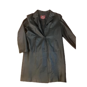 May include: A black leather coat with a notched collar, single-button closure, and two front pockets. The coat is knee-length and has a classic, tailored design. The coat is made of a smooth, shiny leather material.