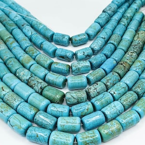 May include: A strand of turquoise beads, each bead is a cylindrical shape with a light blue colour and a marbled pattern.