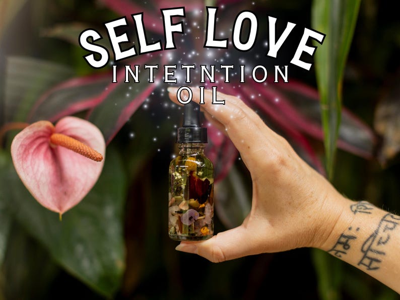 May include: A glass bottle filled with a clear liquid and various dried flowers and herbs. The bottle has a dropper and is labeled "Self Love Intention Oil".