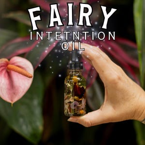 May include: A small glass bottle filled with a golden oil and dried flowers. The bottle has a dropper and is labelled "Fairy Intention Oil".