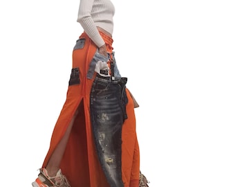 Falda larga extravagante naranja, denim de algodón, falda vanguardista deconstruida con costura exterior.