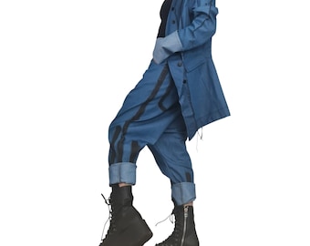 May include: A denim jacket and matching pants set. The jacket is a medium blue with rolled-up sleeves. The pants are also blue with black vertical stripes. The outfit is paired with black platform boots.