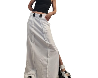Falda larga blanca de algodón para mujer, con costura exterior y detalle de cremallera negra.
