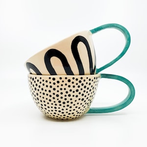 Handmade Ceramic Coffee Mug: Turquoise Handle, Dotted Design, JELKA & RIHARD