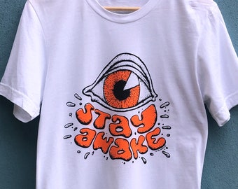 STAY AWAKE unisex t-shirt. Small print batch by Modern Use. 100% Organic cotton.