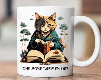 May include: White ceramic mug with a colorful illustration of a cat wearing a kimono and reading a book. The text "ONE MORE CHAPTER, OK?" is printed on the bottom of the mug.