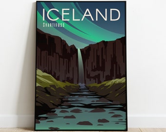 May include: A poster with a black frame featuring a stylized illustration of a waterfall in Iceland. The poster has the text "ICELAND" and "SVARTIFOSS" in white.