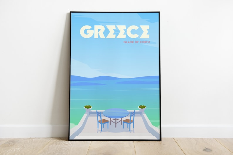 May include: A framed poster with a blue and white illustration of a table and chairs on a patio overlooking a blue ocean. The poster has the text "GREECE ISLAND OF CORFU" in white letters.