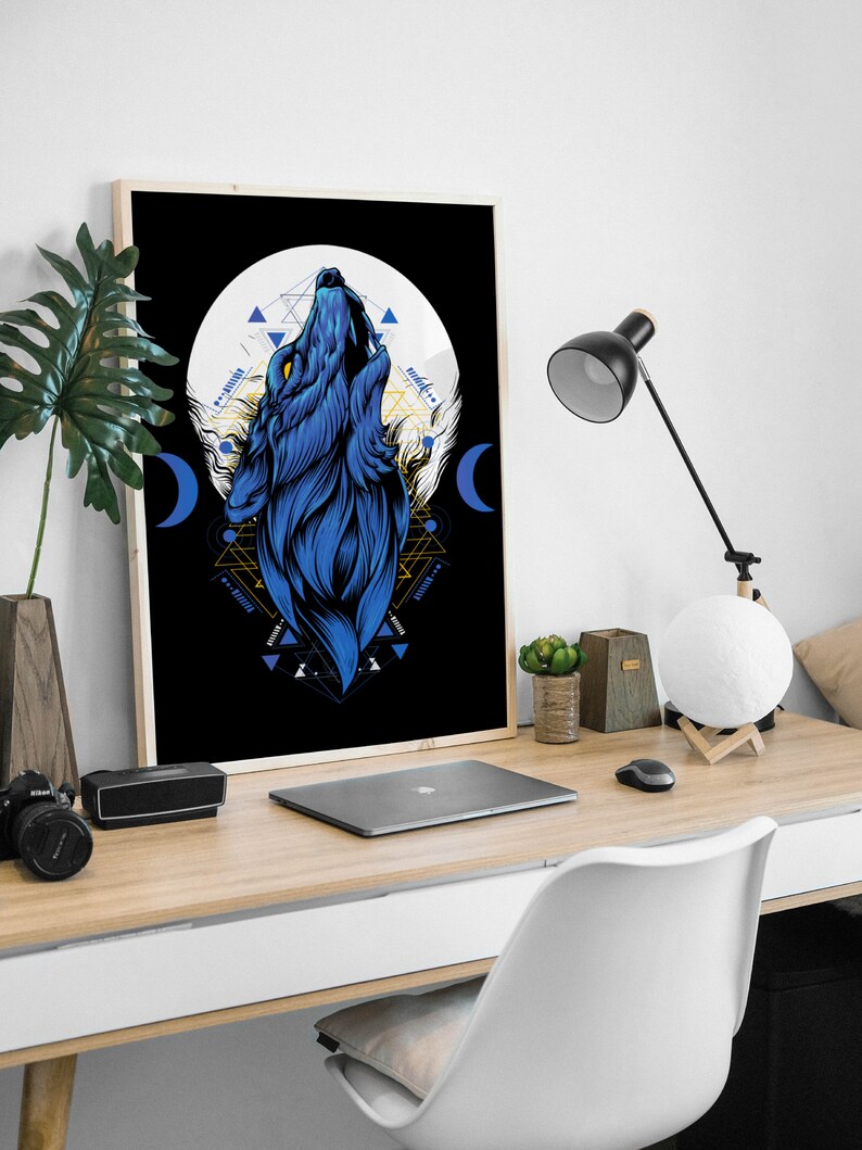 May include: A framed print of a blue wolf howling at the moon with geometric shapes and patterns in gold and white on a black background.