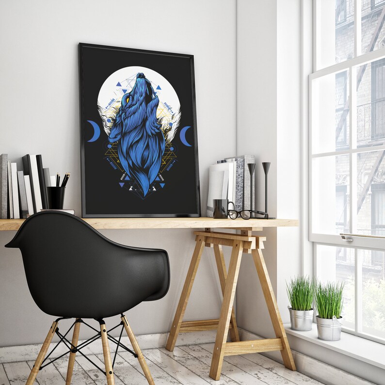 May include: A black and white illustration of a blue wolf howling at the moon. The wolf is surrounded by geometric shapes and a crescent moon. The image is framed and hanging on a wall above a desk.