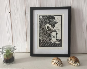 May include: Black and white woodblock print of a woman sitting with a koi fish behind her. The print is framed in a black frame and is titled "Transient Soul" and "Japanese Series # 1 of 100".