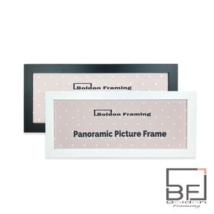 May include: Two panoramic picture frames, one black and one white, with a pink background featuring small white hearts. The frames have a simple design and are labelled "Boldon Framing" and "Panoramic Picture Frame".