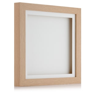 May include: A light wood picture frame with a white mount. The frame is empty and ready for a photo or artwork.