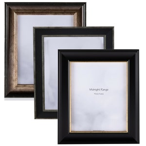 May include: Three picture frames in different colours. The frame on the left is a dark brown with gold accents. The middle frame is black with a dark grey inner border. The frame on the right is black with a gold inner border. The text "Midnight Range Photo Frame" is printed on the white mount of the frame on the right.