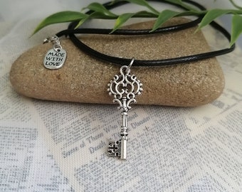 Skeleton key necklace- Silver plated vintage key charm on 18" black wax cord with 2" extension chain, hypoallergenic