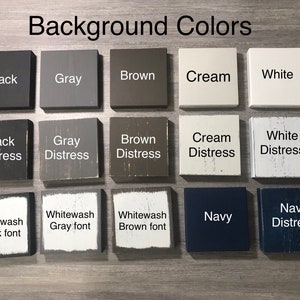 May include: A grid of fourteen square wooden blocks displaying various color options labeled with text including Black, Gray, Brown, Cream, White, Black Distress, Gray Distress, Brown Distress, Cream Distress, White Distress, Whitewash, and Navy.