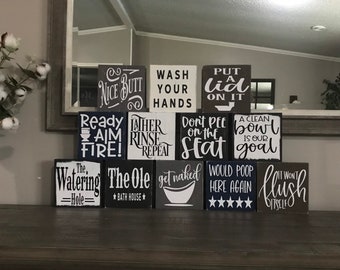 Bathroom shelf decor, small bathroom signs, toilet paper, get naked, poop, Internet cafe, watering hole, put lid on, wash hands, nice butt,