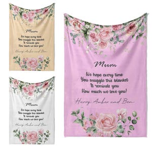 May include: Three pink floral blankets with a personalised message for "Mum". The message reads "We hope every time you snuggle this blanket it reminds you how much we love you!" followed by the names "Harry, Amber and Ben".