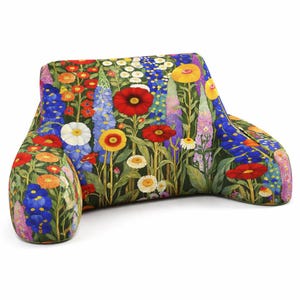 May include: A floral-patterned backrest pillow with a vibrant array of colorful flowers, including red poppies, blue delphiniums, and white daisies. The pillow has a curved design with armrests, perfect for reading or relaxing in bed.