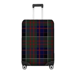 May include: A tartan patterned suitcase in green, red, blue, black, and white. The luggage has a retractable handle and four wheels. The design is a traditional plaid, suitable for travel, with a classic look.