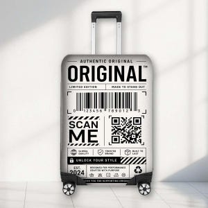 May include: A silver rolling suitcase featuring a black and white graphic design that mimics a shipping label. The text reads ORIGINAL, SCAN ME, and UNLOCK YOUR STYLE, along with a barcode, a QR code, and various icons including a lock and globe.