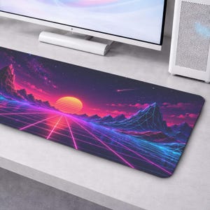May include: A rectangular desk mat featuring a digital landscape with a glowing yellow sun, purple and blue mountains, and a neon pink grid pattern extending into the distance against a dark starry sky with a shooting star in the upper right.