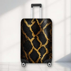 May include: A rectangular upright suitcase featuring a black and gold snakeskin pattern. The luggage has a retractable silver metal handle at the top and four black spinner wheels at the base. The surface displays a detailed scale texture.