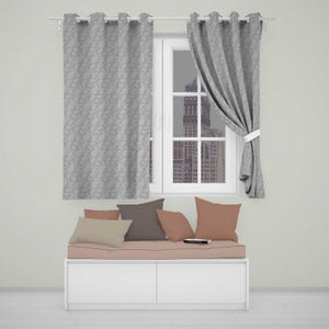 May include: A white window bench with a light pink cushion and four throw pillows in shades of beige, brown, and pink. Above the bench, two grey curtains with a repeating paisley pattern hang from a silver rod, framing a window view.