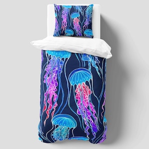 May include: A bed set with a jellyfish design. The duvet cover and pillowcase display a pattern of blue, purple, and pink jellyfish on a dark blue backdrop. The jellyfish are intricately outlined, creating a striking visual effect.