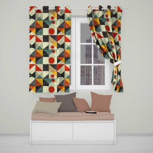 May include: Two window curtains featuring a geometric pattern of triangles, squares, and red circles in shades of orange, yellow, dark blue, and cream. The curtains hang on a white rod above a white bench with four solid-coloured throw pillows.